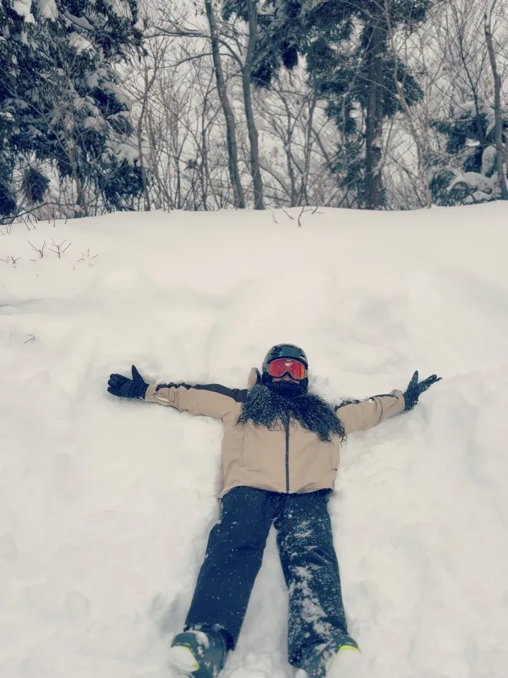 Kay making a snow angel in fresh snow