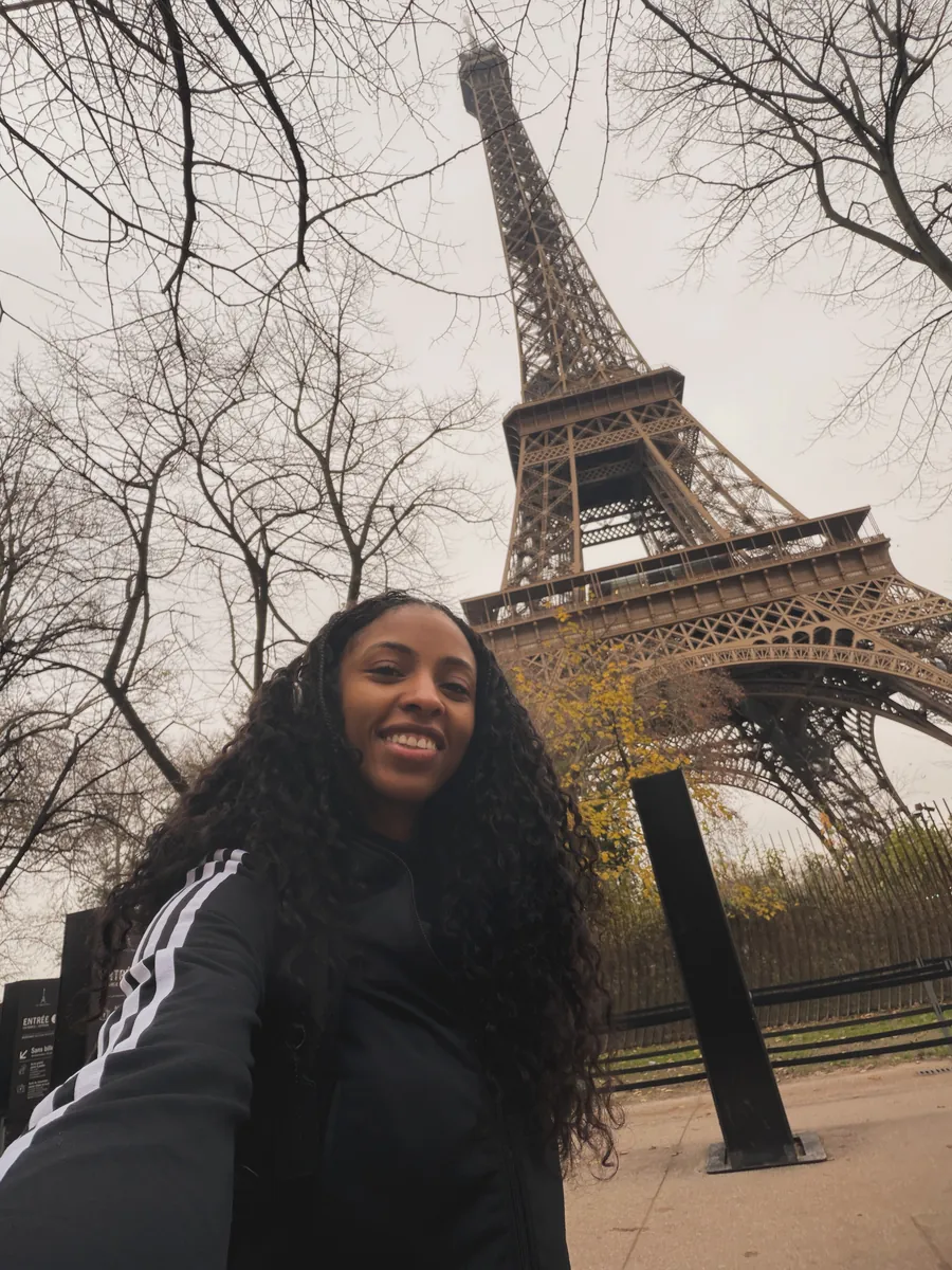 Kay taking a selfie under the Eiffel Tower